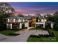 Stunning modern home with spacious driveway and landscaped grounds at 2116 Woodhaven Rd, Charlotte, NC 28211