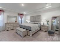 Spacious Primary bedroom with plush bedding and ample furniture at 13050 Regent Grove Ln, Huntersville, NC 28078