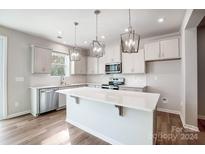 Modern kitchen with island, stainless steel appliances, and light-grey cabinets at 2235 Hedgecliff Rd # 4, Kannapolis, NC 28025