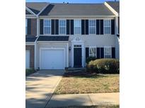 Brick front of two-story townhome with black shutters at 4016 Holly Villa Cir, Indian Trail, NC 28079