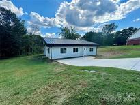Newly built light gray house with dark gray metal roof at 901 Linney Ln, Shelby, NC 28152