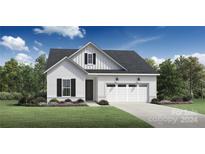 Modern farmhouse style home with white siding and a two-car garage at 5313 Mint Harbor Way # 0312, Charlotte, NC 28269