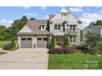 Two-story craftsman home with two-car garage and landscaped yard at 4021 Redwood Ave, Charlotte, NC 28205
