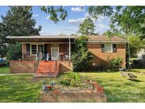 Brick ranch house with covered porch at 1901 Ashcraft Ave, Monroe, NC 28110