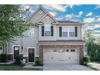 Two-story townhome with gray siding and stone accents at 145 Beacon Dr # F, Mooresville, NC 28117
