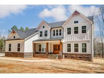 Stunning farmhouse-style home with stone accents at 0002 Bolton Rd, Catawba, NC 28609