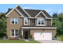 Two-story brick home with gray accents and a two-car garage at 124 Balboa St # 26, Matthews, NC 28104