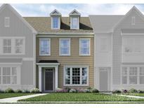 Tan three-story townhome with dormers and landscaping at 4495 Potters Wheel Dr, Fort Mill, SC 29715