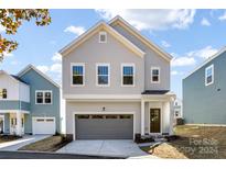 Two-story house with gray siding and two-car garage at 504 Kingsway Cir, Charlotte, NC 28214