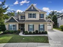 Two story house with two car garage and landscaping at 453 Galbreath Ct, Fort Mill, SC 29708