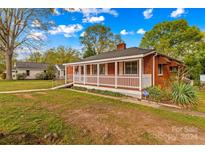 Brick ranch house with a porch and ramp access at 800 Wright Ave, Kannapolis, NC 28083