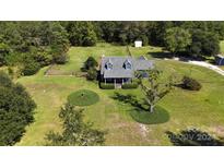 Aerial view of house on large lot with ample green space at 275 Scout Cabin Rd, Kershaw, SC 29067