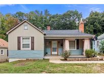 Charming house exterior with light taupe siding, blue accents, and a welcoming front porch at 515 Suttle St, Shelby, NC 28150