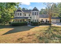 Two story house with wrap around porch at 2720 Lentz Rd, China Grove, NC 28023