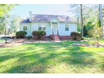 Charming light blue house with well-maintained lawn at 1350 8Th Nw St, Hickory, NC 28601