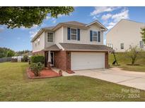 Two-story brick home with attached garage at 1994 Quill Ct, Kannapolis, NC 28083