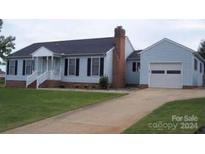 Charming light blue ranch home with a large yard and attached garage at 106 Ohara Dr # 17, Salisbury, NC 28147