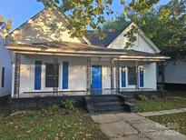 Charming white house with blue doors at 508 S Yadkin Ave, Spencer, NC 28159