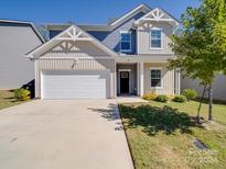 Two-story home with gray siding and white trim at 111 Fosters Glen Pl, Mooresville, NC 28115