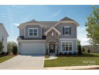 Two-story house with gray siding and stone accents at 2055 Sabra St # Cwo0044, Gastonia, NC 28054