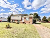 Brick ranch home with a large backyard and attached deck at 2223 Chatham St, Newton, NC 28658