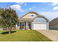 Charming one-story home with light blue siding and two-car garage at 3157 Delaware Dr, Denver, NC 28037