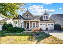 Beautiful two-story home with a charming front porch and two-car garage at 5021 Henshaw Rd, Waxhaw, NC 28173