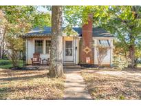 Charming bungalow with brick chimney and front porch at 710 Wood St, Statesville, NC 28677