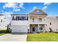 Two-story house with white siding and gray roof at 5234 Verona Rd # 79, Charlotte, NC 28213