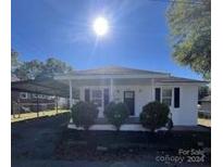 Newly renovated home with front porch and carport at 560 2Nd St, Chester, SC 29706