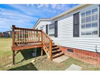 Home with a wooden deck and carport at 109 Farmway Ln, Shelby, NC 28150