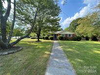 Brick ranch house with a large front yard at 3730 Birchdale Ct, Matthews, NC 28104