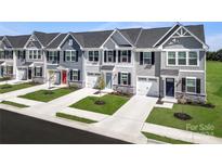 New townhouses with attached garages and landscaped yards at 107 Jameson Park Dr # 3, Troutman, NC 28166