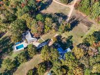 Aerial view of home, pool, and detached building at 846 Windy Oaks Way, Lancaster, SC 29720