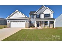 Two-story home with gray and white siding, two-car garage at 201 Wedge View Way, Statesville, NC 28677