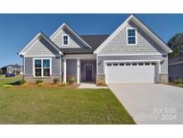 Ranch home with gray siding and a two-car garage at 103 Bunker Hill Ln, Statesville, NC 28677
