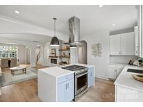 Spacious kitchen with large island, stainless steel appliances and open layout at 12239 Monteith Grove Dr, Huntersville, NC 28078