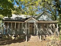Older home with screened porch and yard at 1115 Harrill St, Charlotte, NC 28205