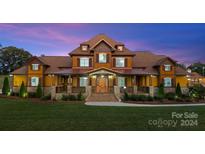 Two story home with large front porch and landscaping at 3460 Jennings Rd, Union Grove, NC 28689