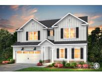 Stunning two-story home with a light gray exterior and a two-car garage at 14118 Penbury Ln # 338, Charlotte, NC 28278