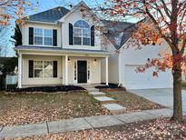 Two-story house with a large front porch and attached two-car garage at 19202 Kanawha Dr, Cornelius, NC 28031