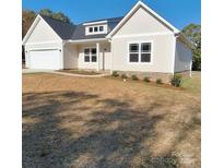 New construction home with neutral exterior and two-car garage at 420 Godwin St, Marshville, NC 28103