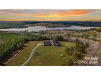 Luxury home with lake view; long driveway and expansive property at 590 Tuckertown Rd, New London, NC 28127