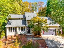 Two-story house with gray siding, stone accents, and a two-car garage at 16008 Samar Ct, Tega Cay, SC 29708