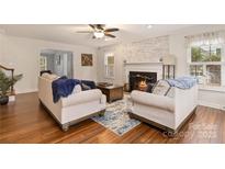 Cozy living room features a fireplace and hardwood floors at 2876 Oakhurst Dr, Rock Hill, SC 29732