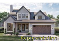Two story house with gray siding, brown door and garage at 325 Bonaventure Dr, Salisbury, NC 28147