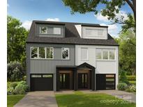 Modern two-unit building with gray and white siding, black garage doors, and landscaping at 1620 Wildlife Rd, Charlotte, NC 28214