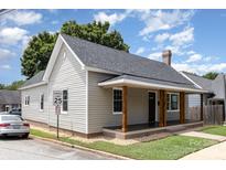 Charming craftsman style home with gray siding and a wood front porch at 201 Mccubbins St, Salisbury, NC 28144