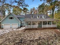 Two-story light blue house with a front porch at 1259 Blacksnake Rd, Stanley, NC 28164