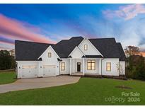 Stunning two-story home with a white exterior, two-car garage, and a manicured lawn at 108 Augusta Ln, Shelby, NC 28150